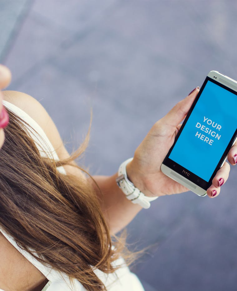 Download Free SONY smartphone in hands of a woman Mockup generator | Smartmockups