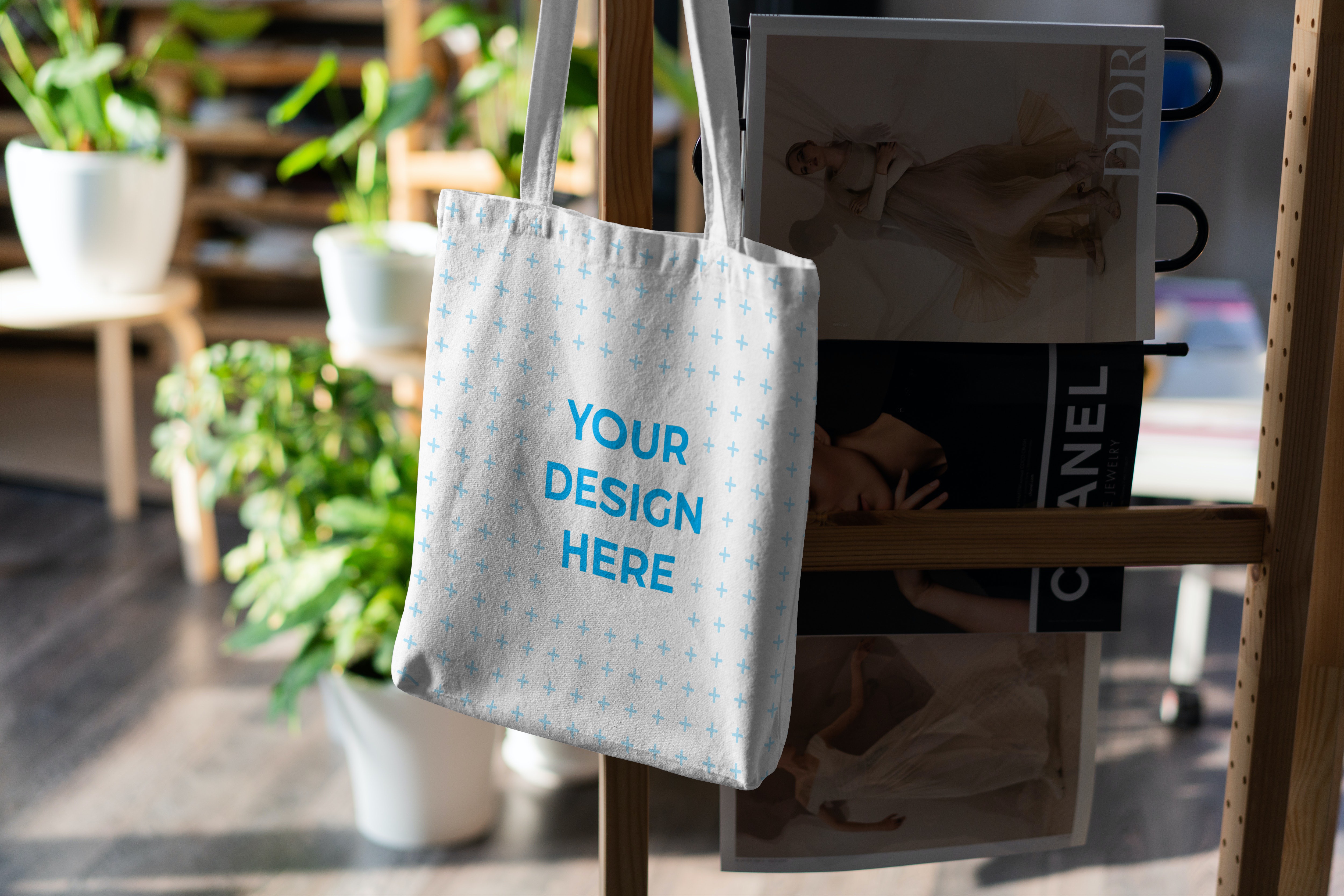 Free Tote bag hanging on a chair Mockup generator